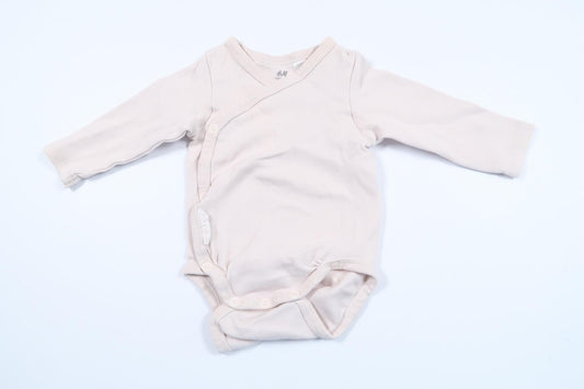 Lyserød bodysuit fra H&M i størrelse 56