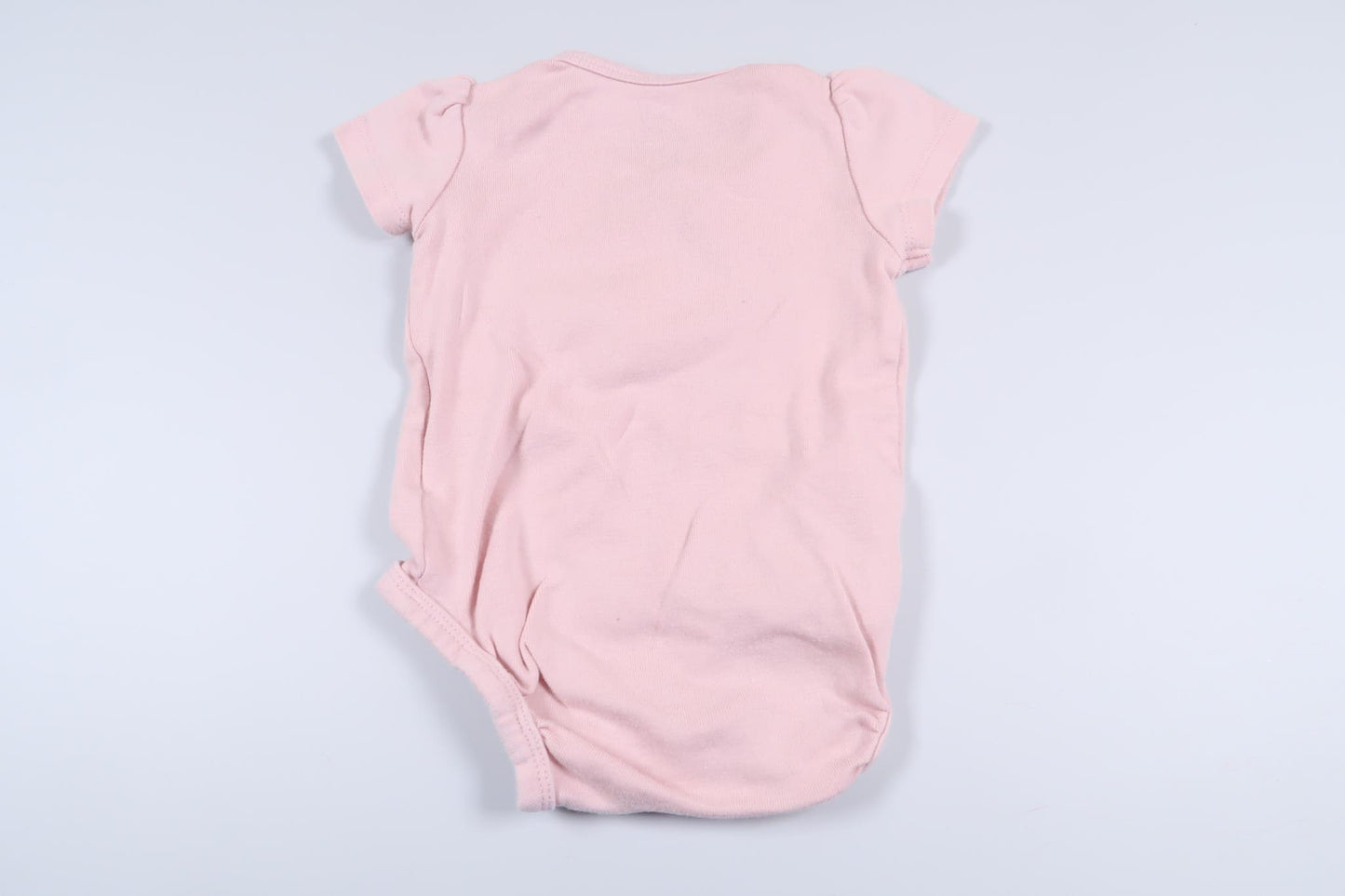 Lyserød bodysuit fra H&M i størrelse 62