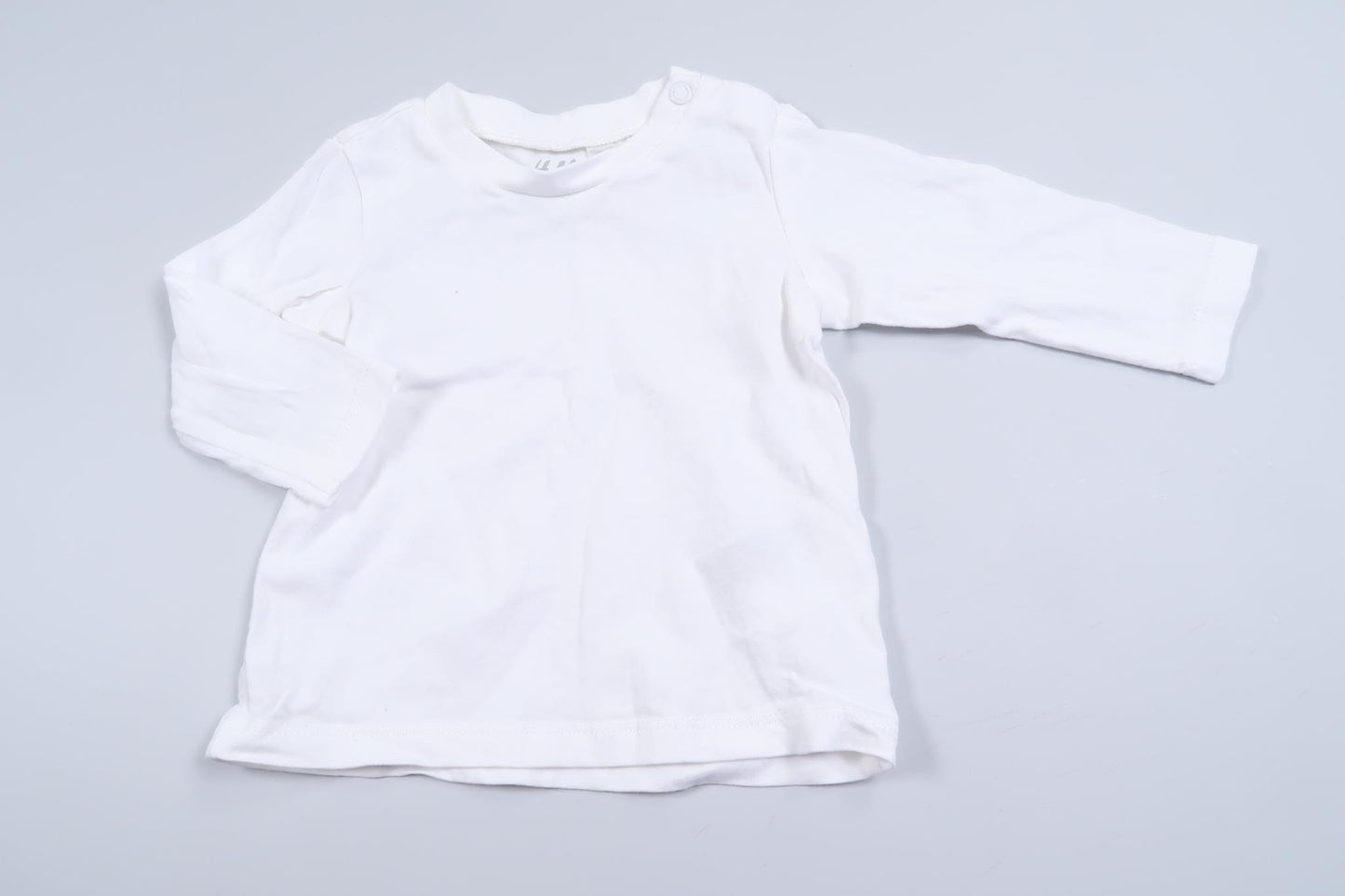 Hvid langærmet skjorte fra H&M i størrelse 62