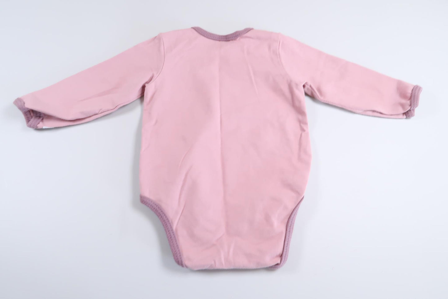 Lyserød langærmet bodysuit i størrelse 68