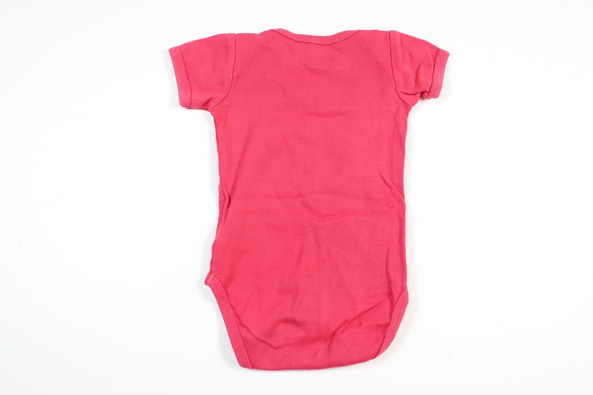 Lyserød kortærmet bodysuit fra Name It i størrelse 62
