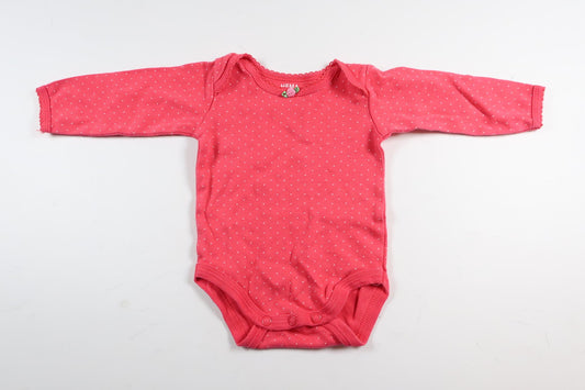 Neonlyserød polkaprikket bodysuit med lange ærmer fra HEMA i størrelse 50/56