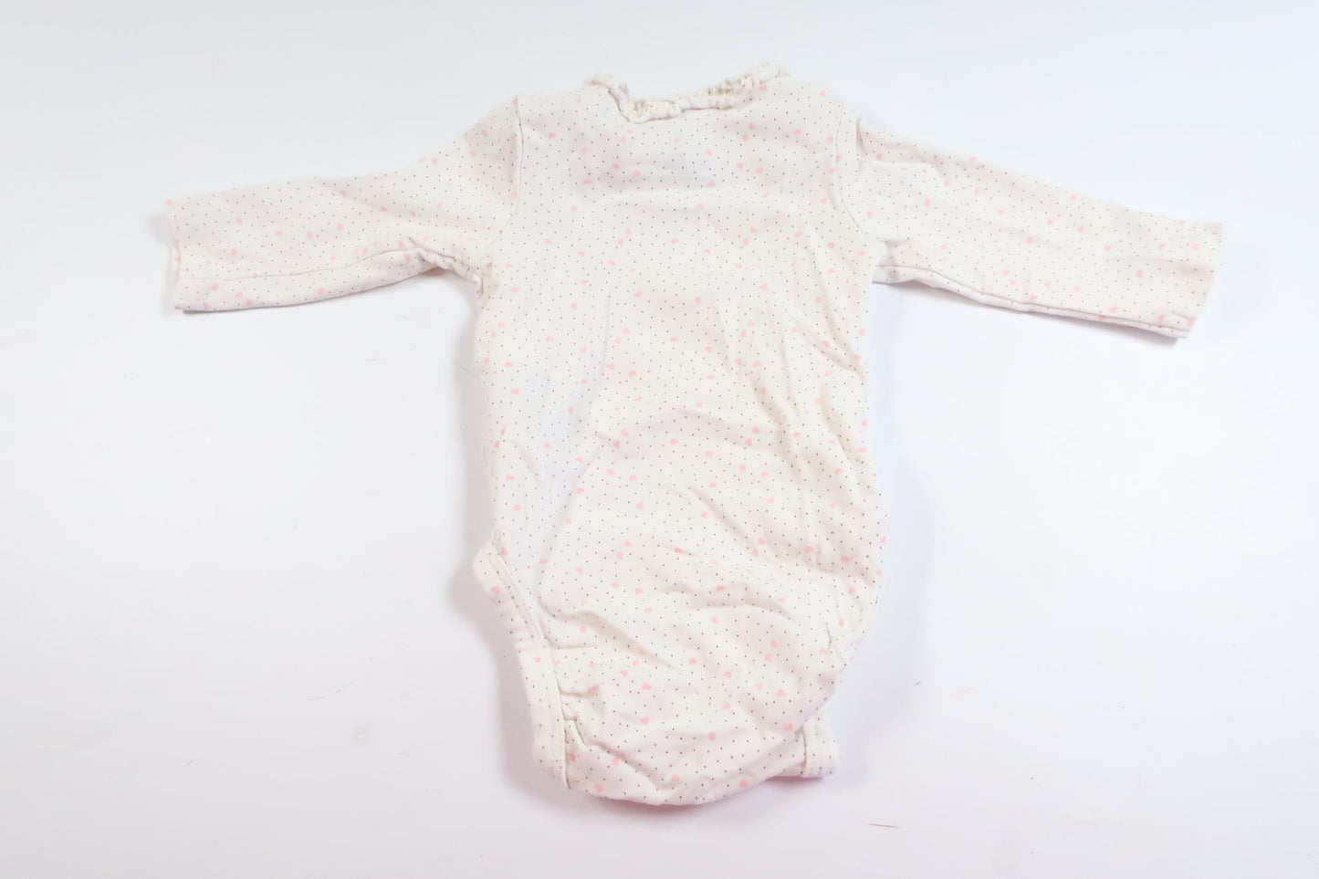 Hvid langærmet bodysuit med hjerter og prikker fra H&M i størrelse 50